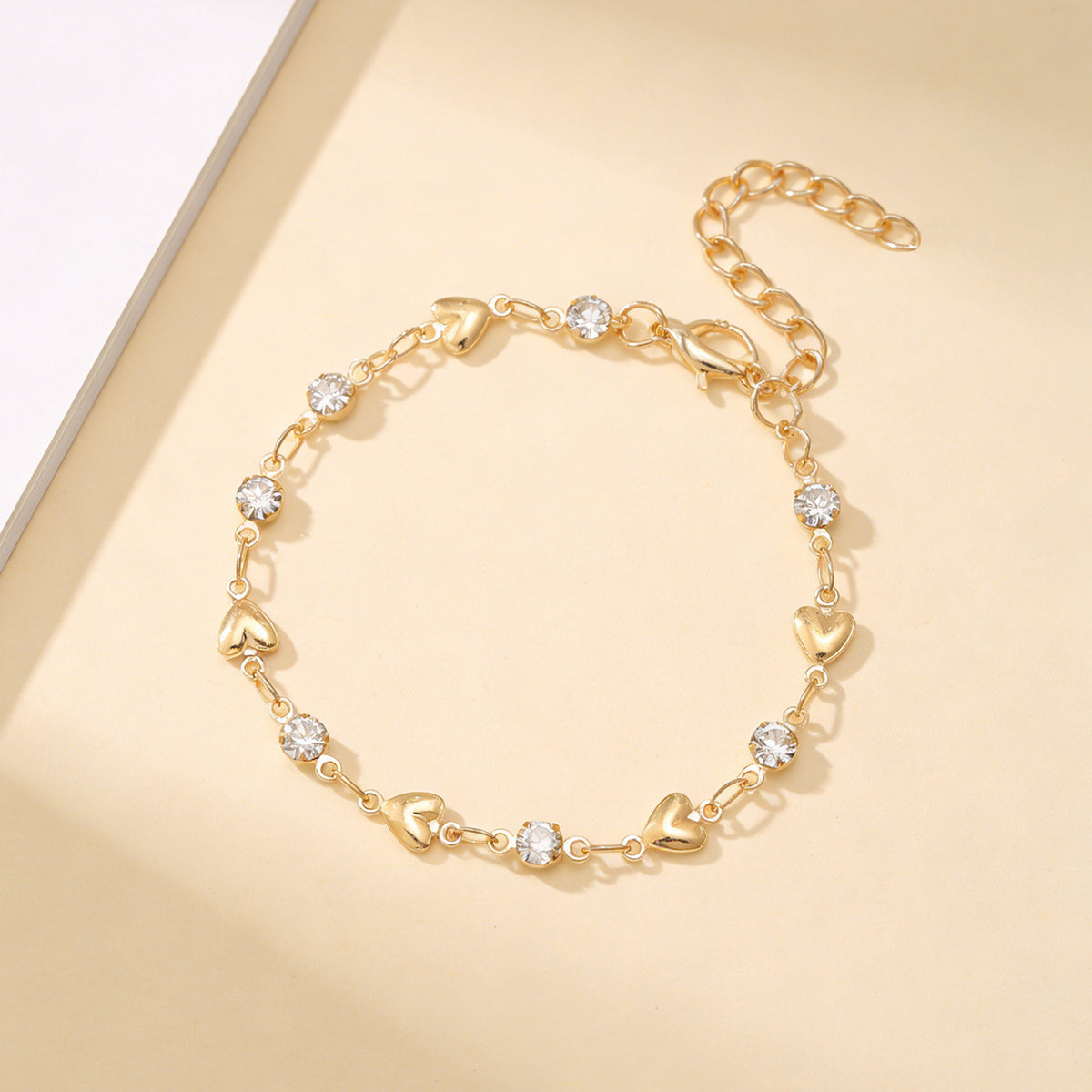 Venus heart charm bracelet shown with its adjustable cable chain and clasp
