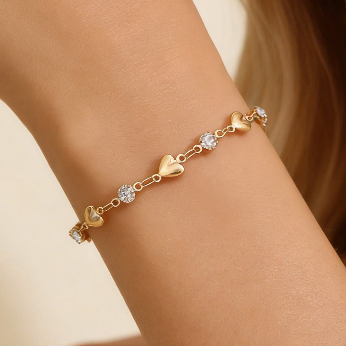 Hollow heart charm bracelet on a fine cable chain — waterproof, tarnish-free PVD-plated stainless steel
